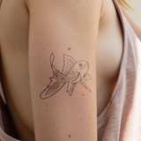 Blumiger Goldfisch Tattoo